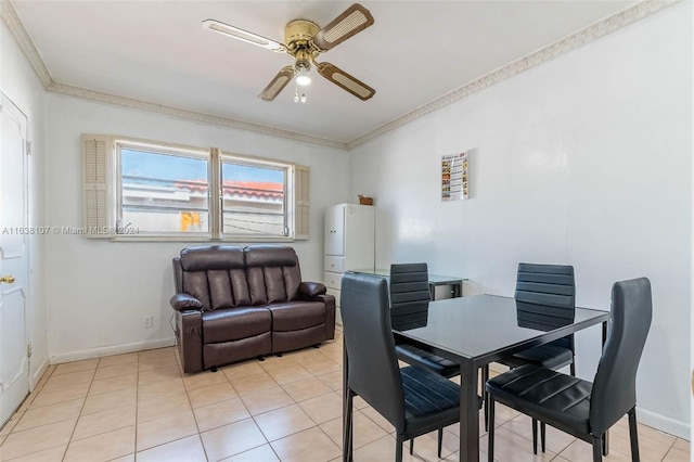 dining area featuring ceiling fan, crown molding, and light tile patterned flooring