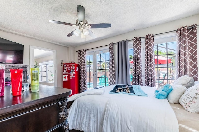 carpeted bedroom with ceiling fan, a textured ceiling, access to outside, and french doors