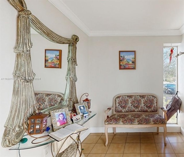 sitting room featuring tile patterned floors and crown molding