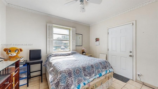 bedroom featuring ceiling fan, light tile patterned floors, and crown molding