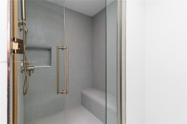 bathroom with a tile shower