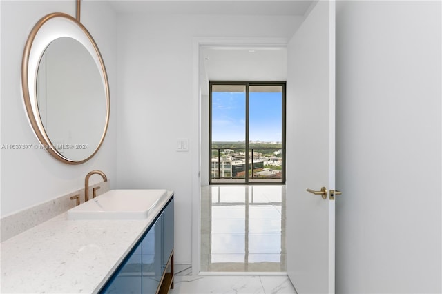 bathroom with vanity and tile patterned floors