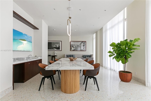 dining space with plenty of natural light and sink