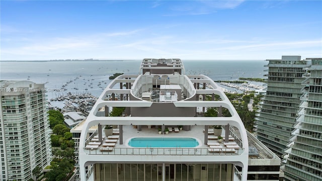 birds eye view of property with a water view