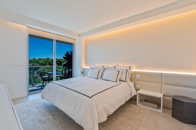 tiled bedroom with floor to ceiling windows and access to exterior