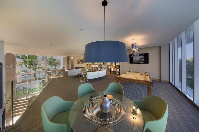 carpeted dining area with pool table and floor to ceiling windows