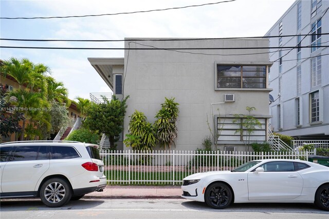 view of side of property featuring a balcony