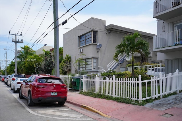 view of building exterior with an AC wall unit