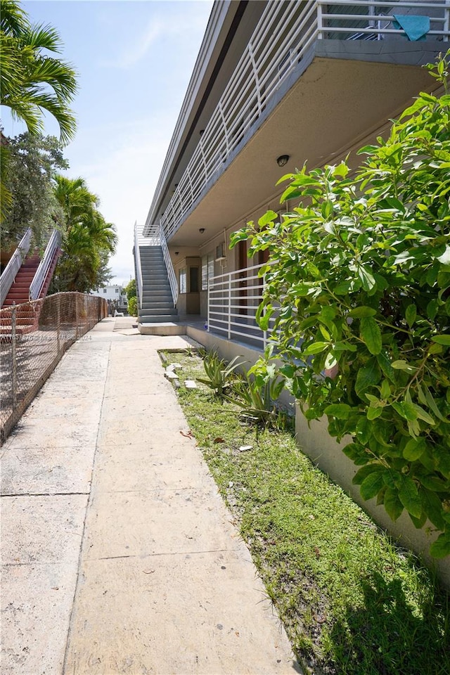 view of side of property with a balcony