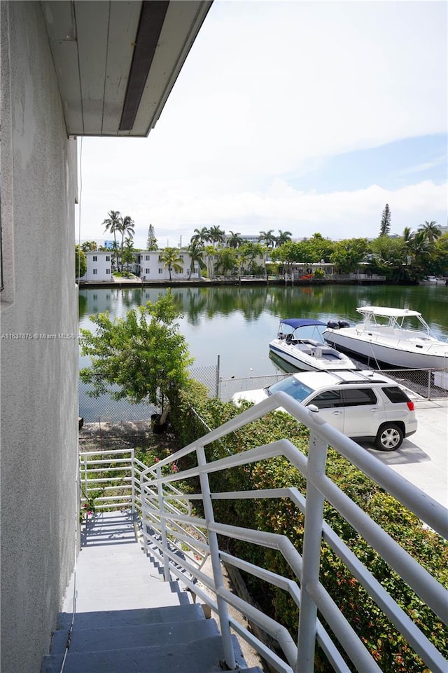 balcony featuring a water view