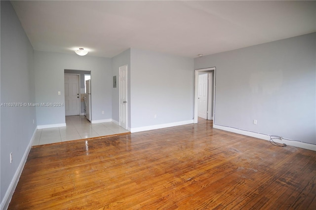 spare room with light hardwood / wood-style flooring