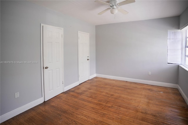 unfurnished room featuring hardwood / wood-style floors and ceiling fan