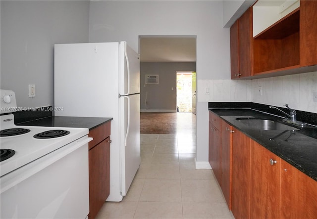 kitchen with dark stone counters, decorative backsplash, sink, white electric range oven, and light tile patterned floors