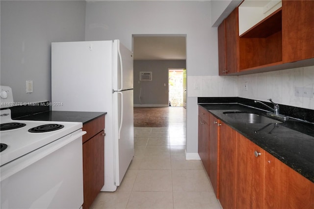 kitchen featuring tasteful backsplash, white electric range, sink, dark stone countertops, and light tile patterned floors