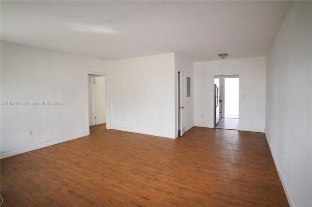 spare room with wood-type flooring