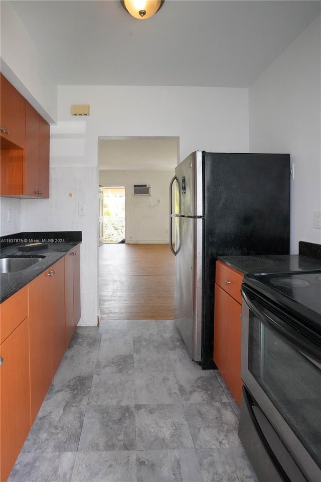 kitchen with sink, stainless steel electric range oven, and light tile patterned floors