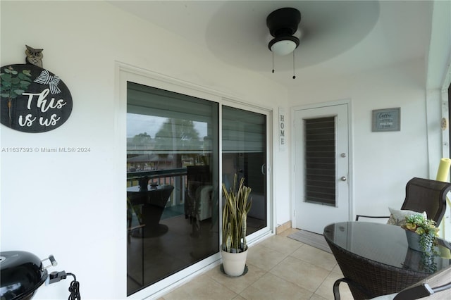 exterior space with ceiling fan