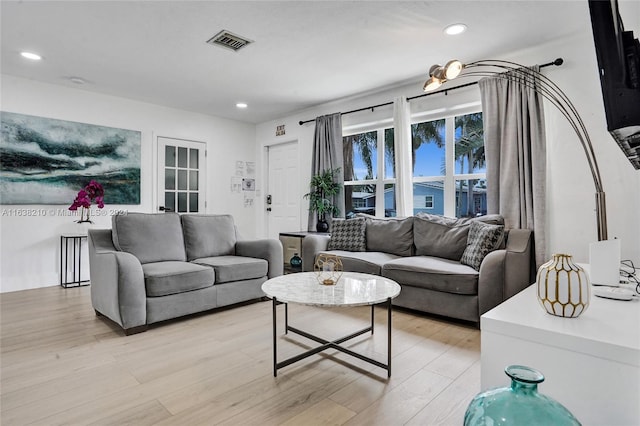 living room with light hardwood / wood-style floors