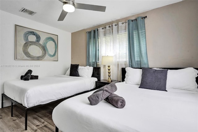 bedroom featuring hardwood / wood-style floors and ceiling fan