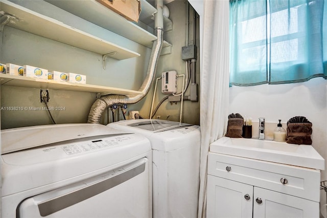 laundry area with washing machine and dryer