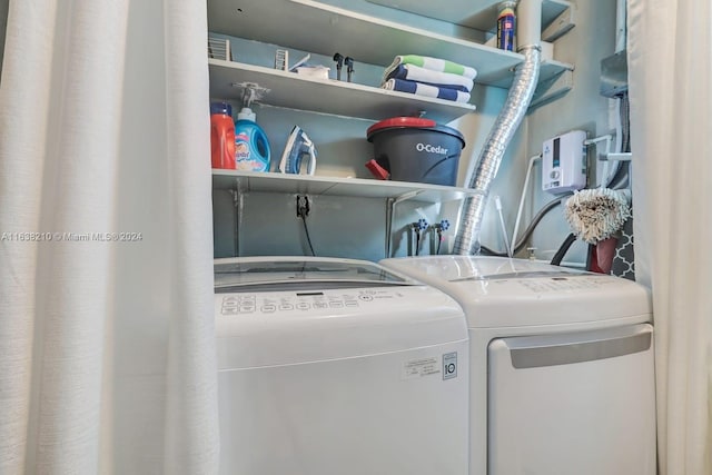 laundry area with washing machine and dryer