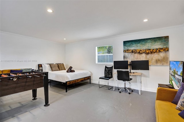 bedroom with concrete floors and ornamental molding