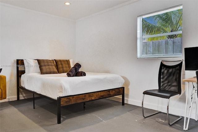 bedroom featuring ornamental molding and concrete floors