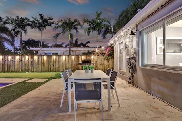 view of patio terrace at dusk