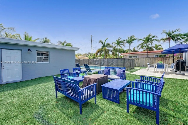 view of yard with a patio area and a fenced in pool