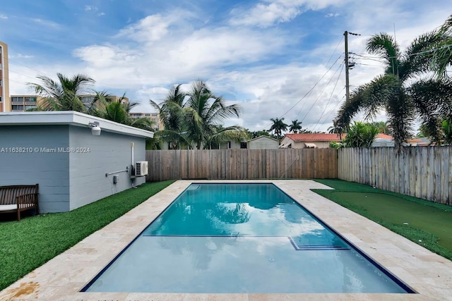 view of pool featuring central air condition unit