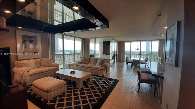 tiled living room featuring floor to ceiling windows