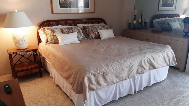 bedroom with light colored carpet