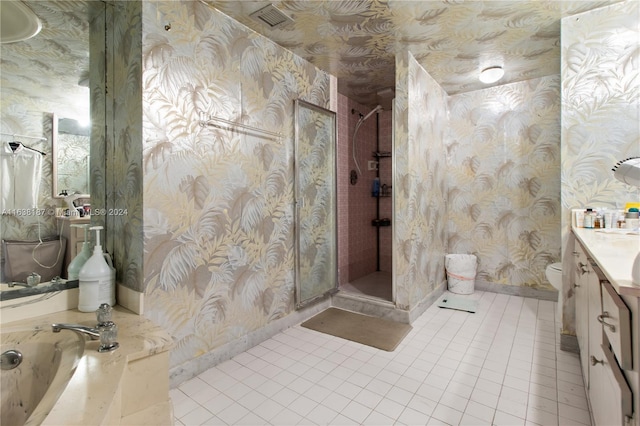 full bathroom with shower with separate bathtub, tile patterned floors, vanity, and toilet