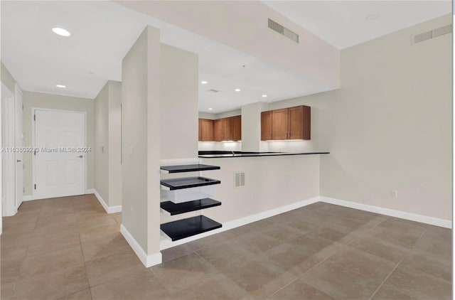 stairs featuring tile patterned floors