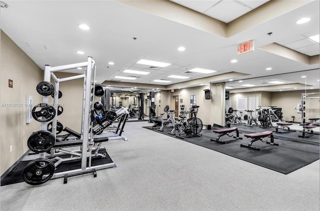 gym with a paneled ceiling