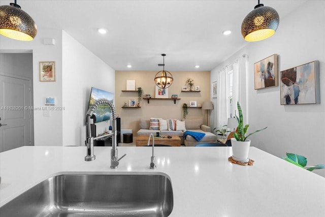 kitchen with hanging light fixtures and sink