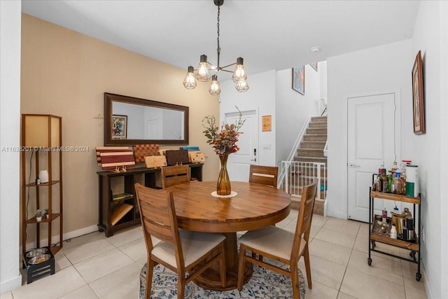 tiled dining space with a notable chandelier