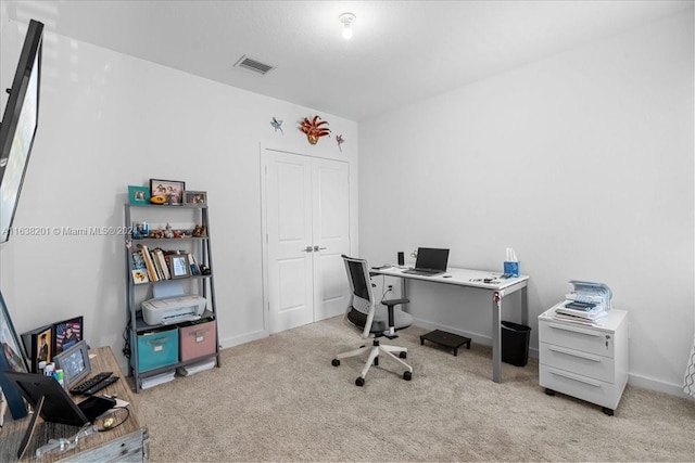 home office featuring light colored carpet