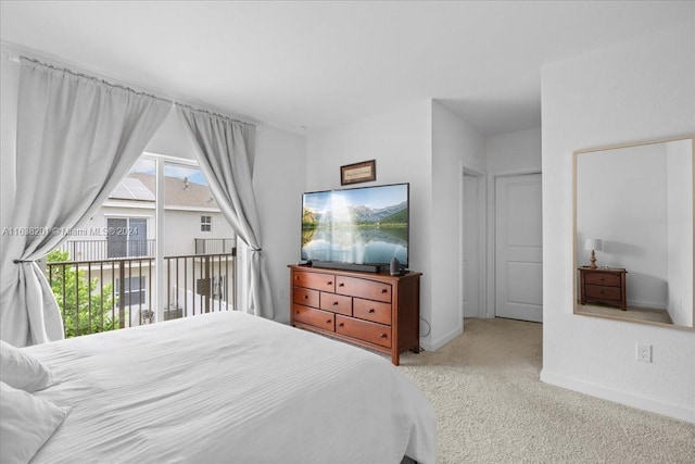 bedroom featuring a closet and light colored carpet