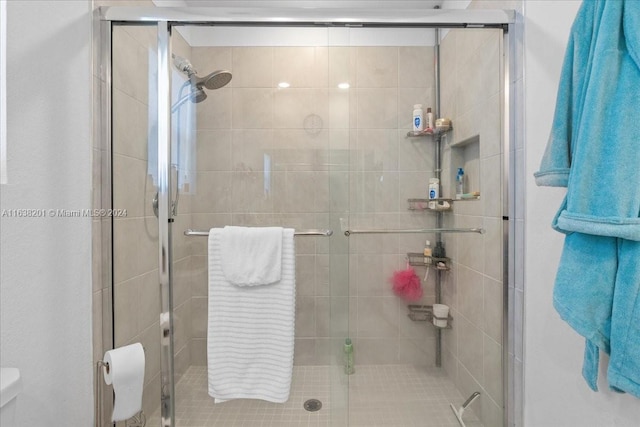 bathroom featuring an enclosed shower