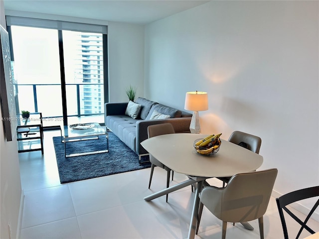 tiled living room featuring expansive windows