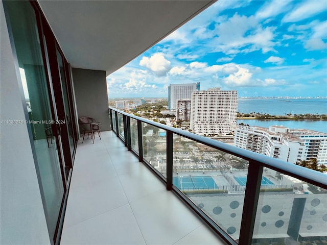 balcony featuring a water view