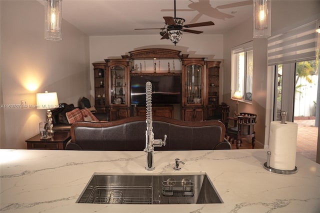 living room with ceiling fan and tile patterned floors