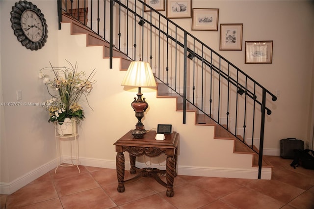 stairs featuring tile patterned floors