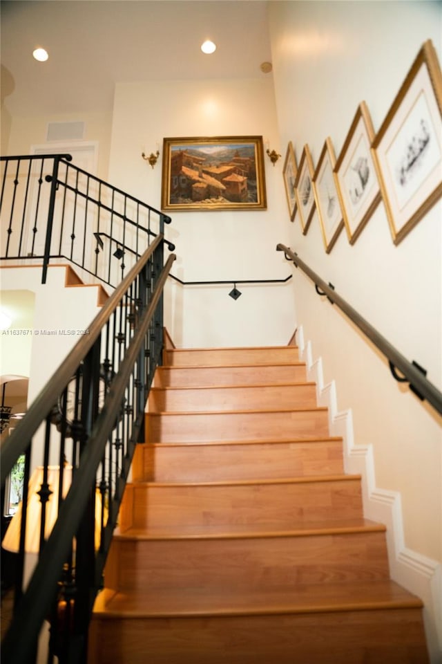 stairs with wood-type flooring