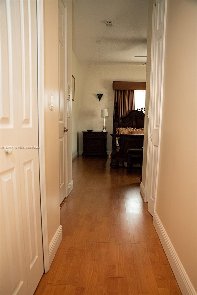 hall with light wood-type flooring