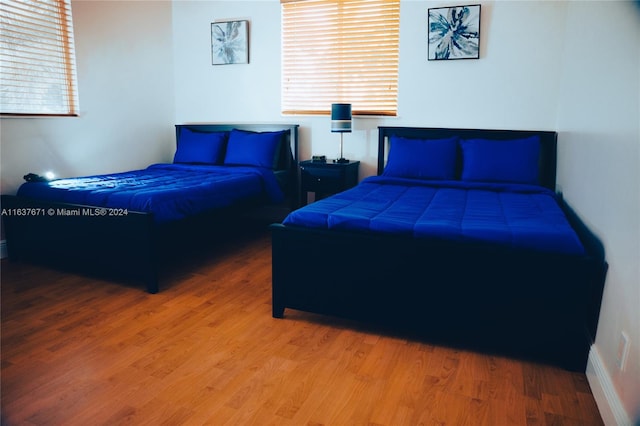 bedroom with wood-type flooring