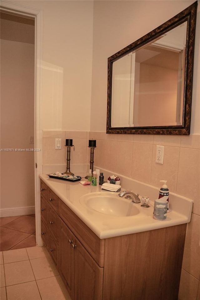 bathroom featuring decorative backsplash, tile walls, tile patterned floors, and vanity