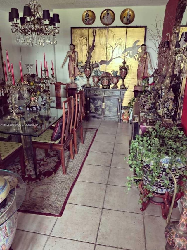 dining space featuring an inviting chandelier and tile patterned floors