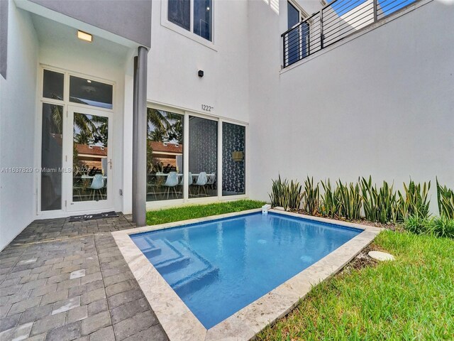 view of swimming pool with a patio